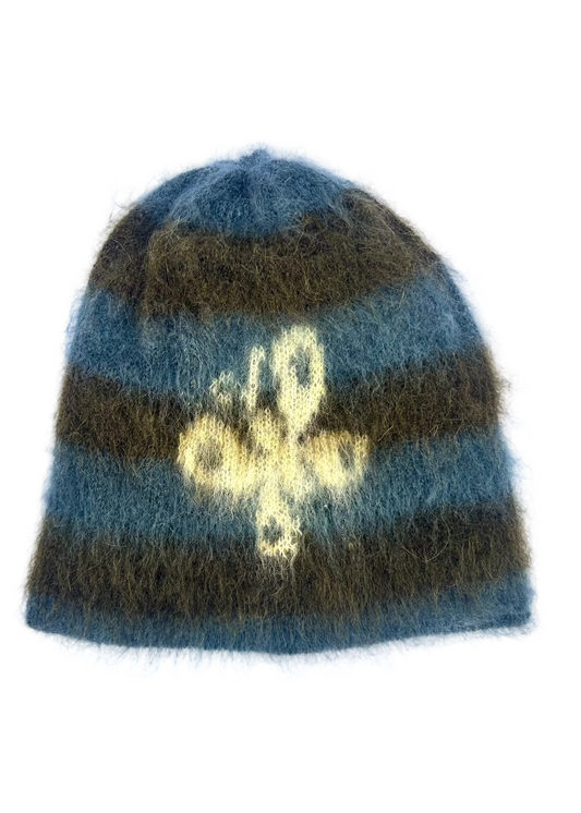 Soft striped beanie with a butterfly motif in blue and olive tones. A cozy, lightweight knit hat with a fuzzy texture — perfect for everyday wear.